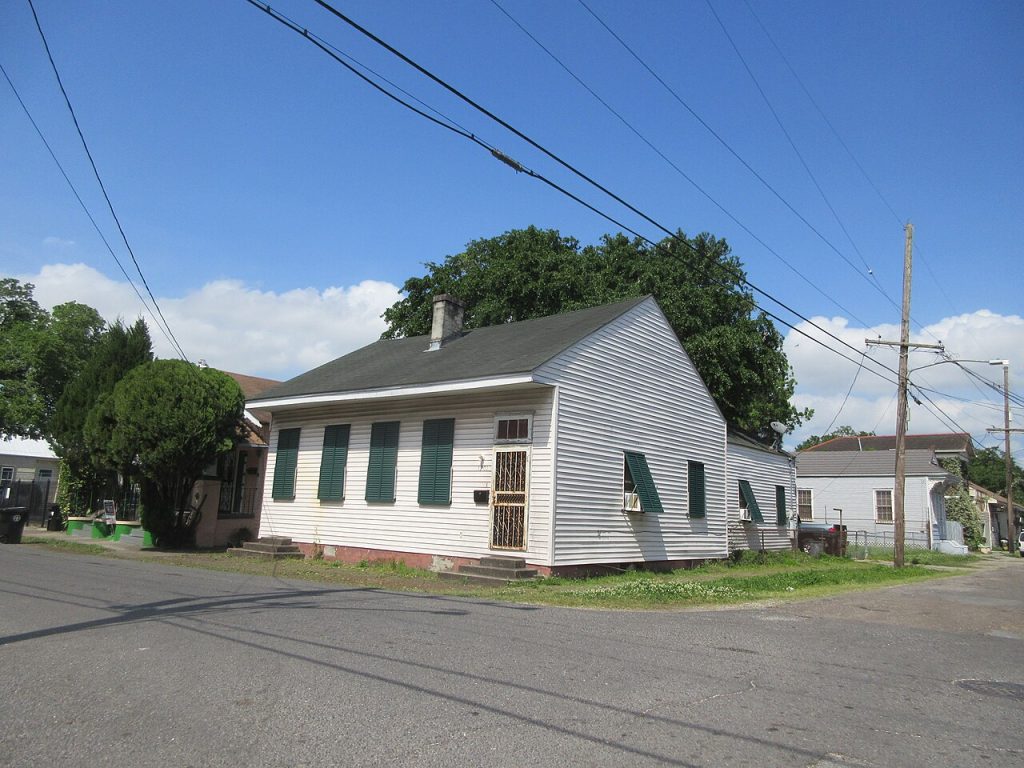 White Creole cottage with green shutters in the Faubourg Marigny