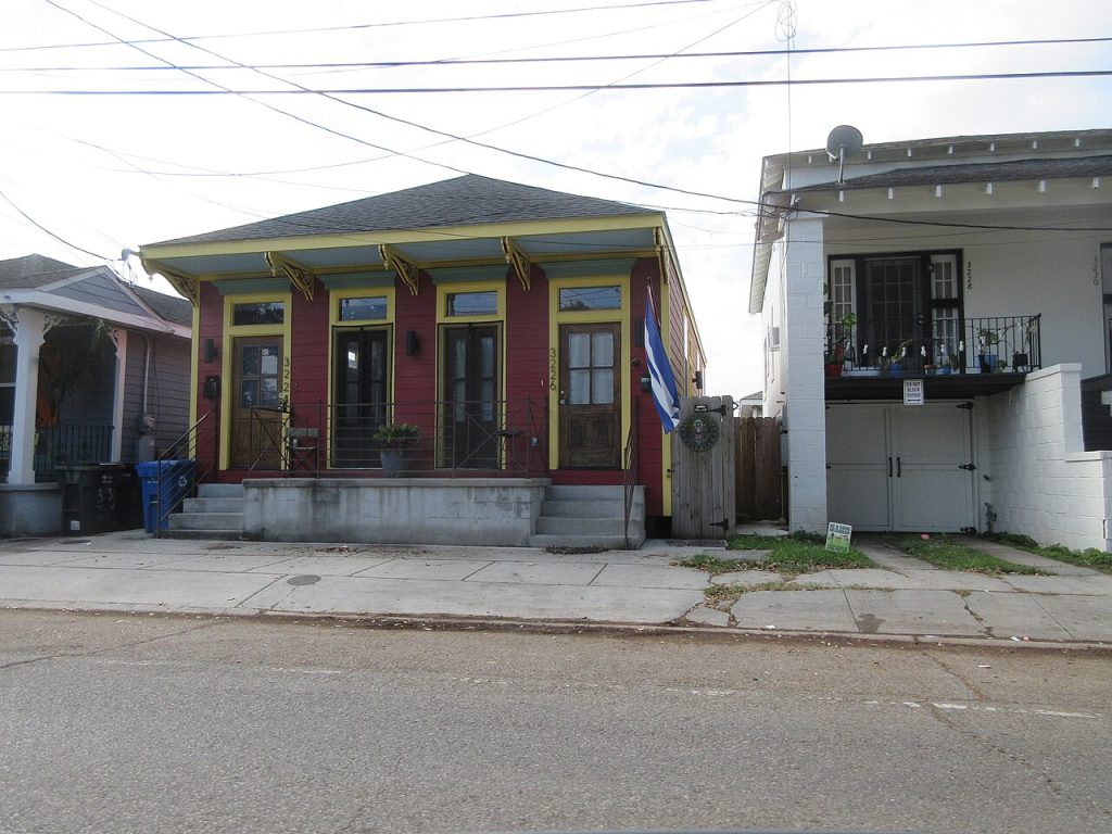 Brightly painted shotgun double house in Mid-City New Orleans